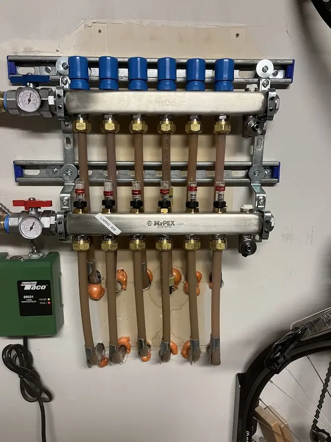 Plumber performing Water Heater Repair at a residential property in Tuxedo